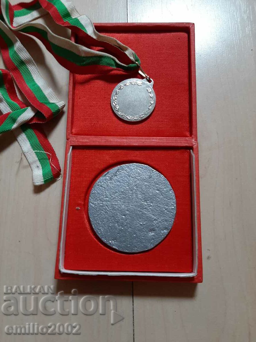 Delivery of Football plaque and medal Delivery of Football plaque and medal