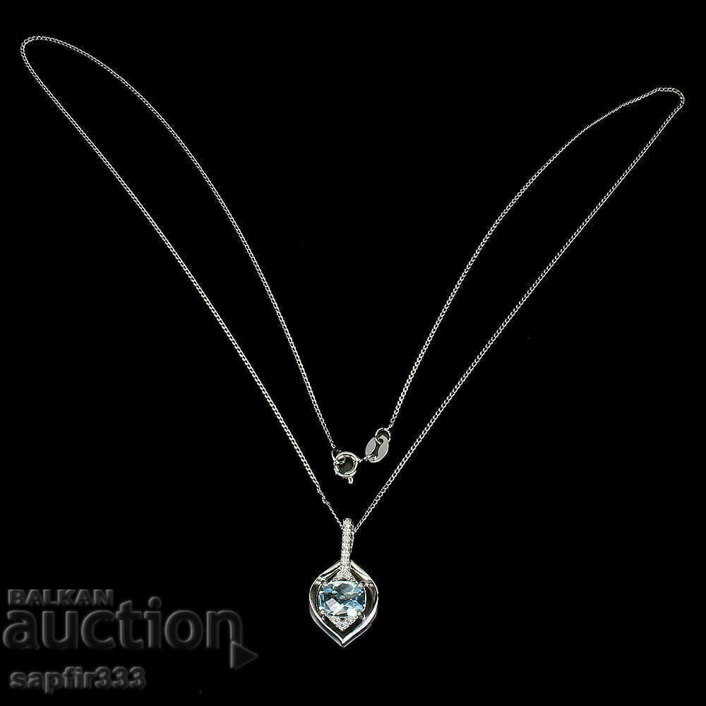 Auction  FINE SILVER MEDALLION WITH NATURAL BLUE TOPAZ AND ZIRCONIA