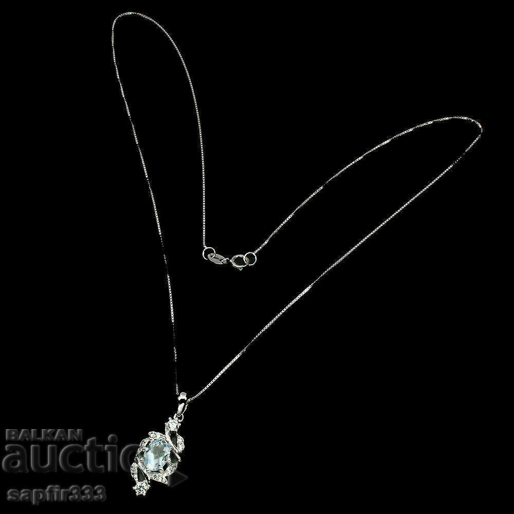 Auction FINE SILVER MEDALLION WITH NATURAL BLUE TOPAZ AND ZIRCONIA Auction FINE SILVER MEDALLION WITH NATURAL BLUE TOPAZ AND ZIRCONIA