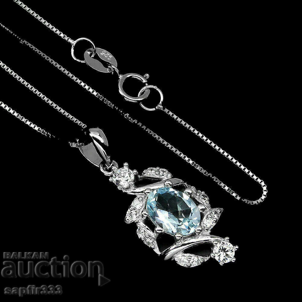 FINE SILVER MEDALLION WITH NATURAL BLUE TOPAZ AND ZIRCONIA