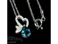 FINE SILVER MEDALLION WITH NATURAL BLUE TOPAZ AND ZIRCONIA