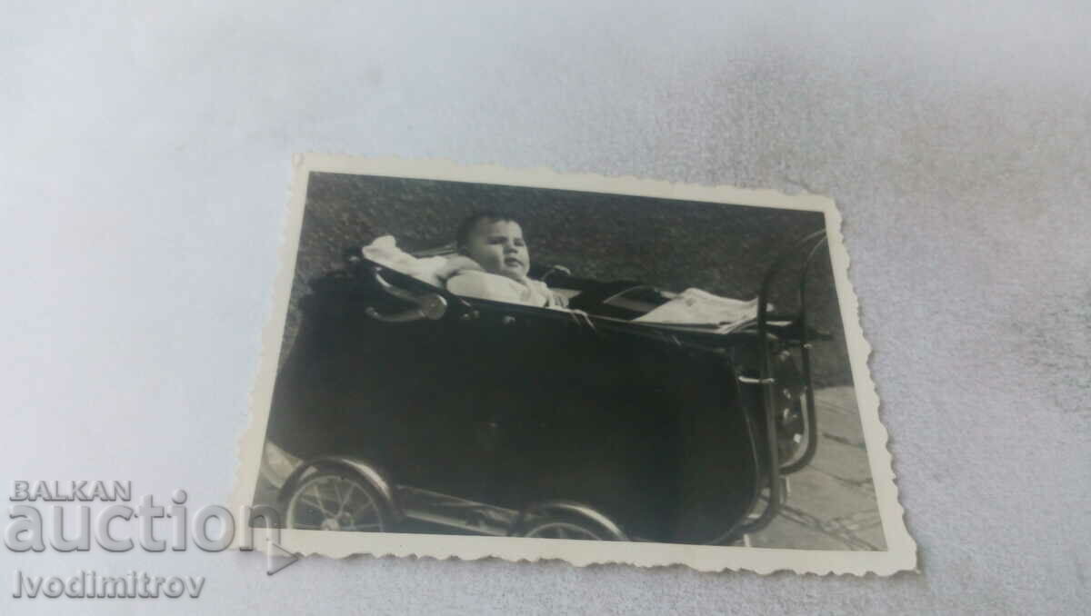 Photo Baby in a retro stroller