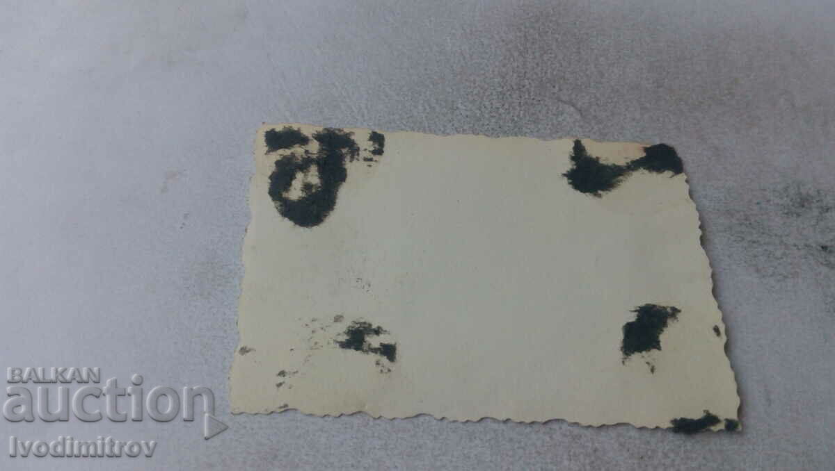 Photo Sofia Three men and a little boy in front of a shop with price 2.65 BGN | € 1.35