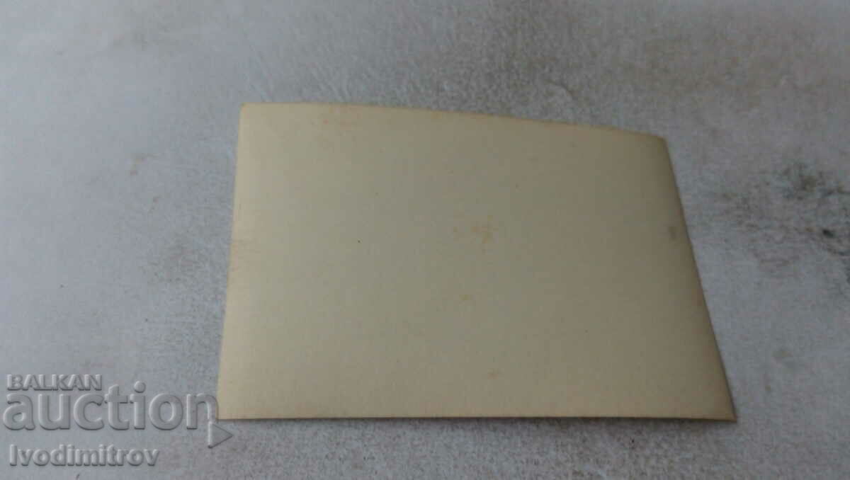 Photo A young woman with a wolf-breed dog by the river with price 2.35 BGN | € 1.20