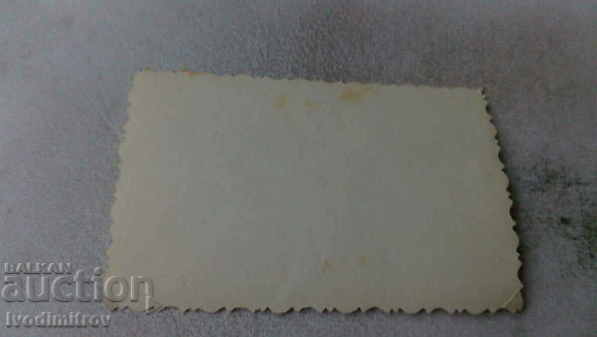 Photo Two men and two women on the street with price 1.35 BGN | € 0.69