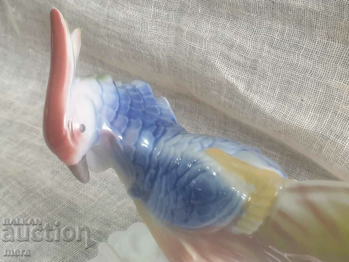Auction Large porcelain figure of a parrot Auction Large porcelain figure of a parrot