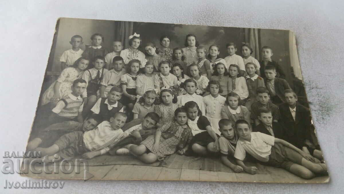 Photo Sliven Pupils from the IV department. with his teacher 1944
