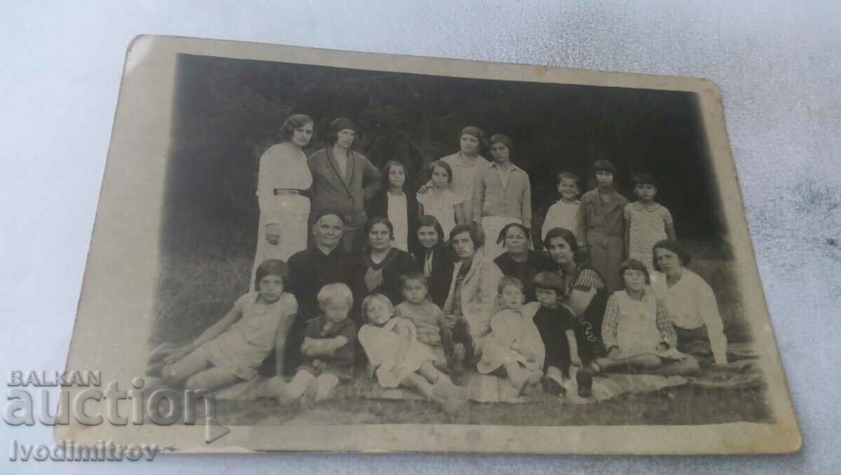 Photo Women and children on the meadow
