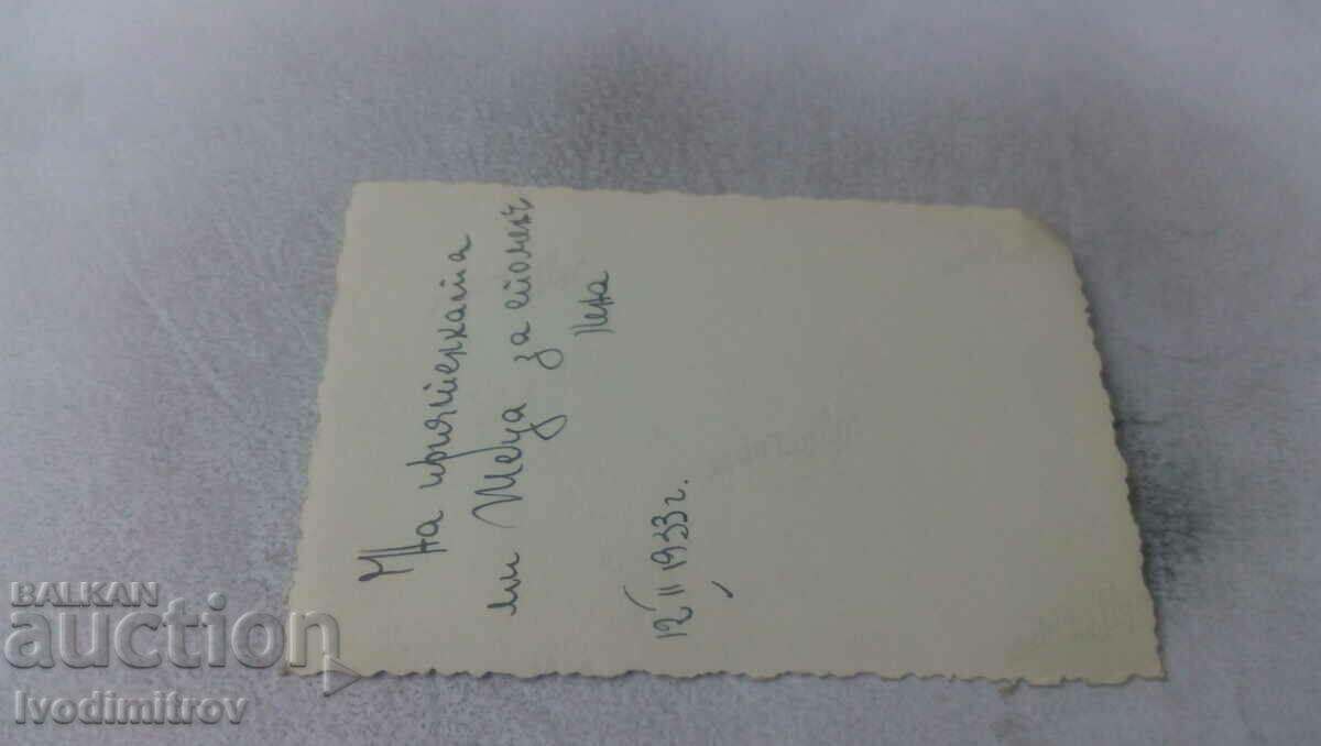 Photo Sofia A young woman on the sidewalk in front of a store with price 2.65 BGN | € 1.35 Photo Sofia A young woman on the sidewalk in front of a store with price 2.65 BGN | € 1.35