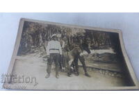 Foto Doi ofițeri și un bărbat pe un măgar în pădure 1935