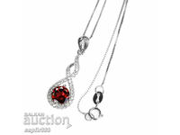 FINE SILVER MEDALLION WITH NATURAL GARNET AND ZIRCONIA