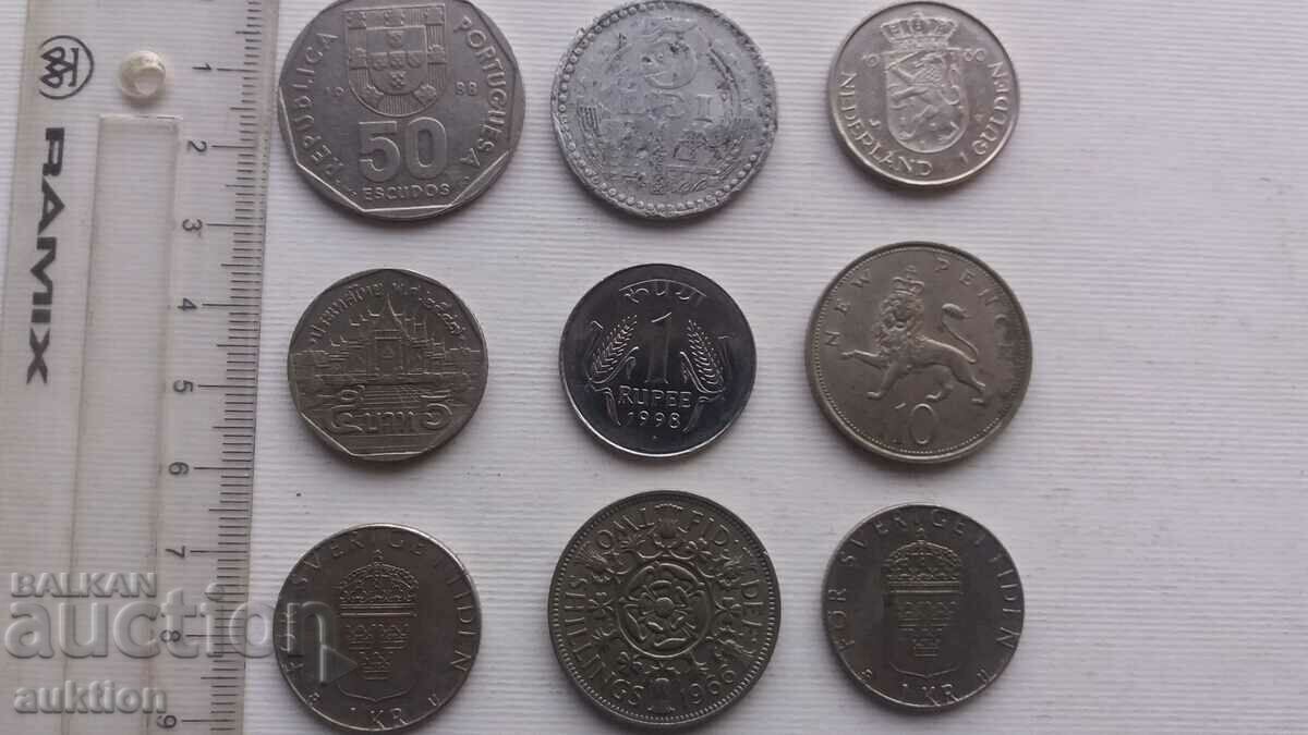 A COLLECTION OF 9 DIFFERENT COINS FROM AROUND THE WORLD