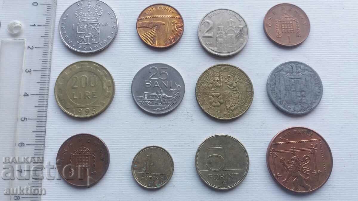 A COLLECTION OF 12 DIFFERENT COINS FROM AROUND THE WORLD