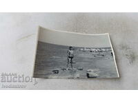Fotografie Nessebar Man pe o piatră lângă mare 1968