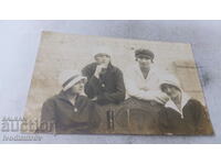 Photo Sliven Four 7th grade students on a bench 1925