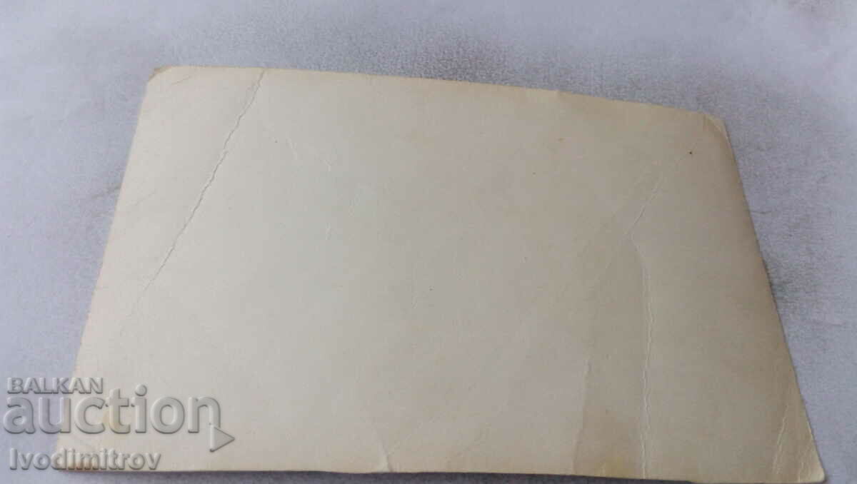 Photo Officer and woman with a bouquet of flowers with price 1.45 BGN | € 0.74