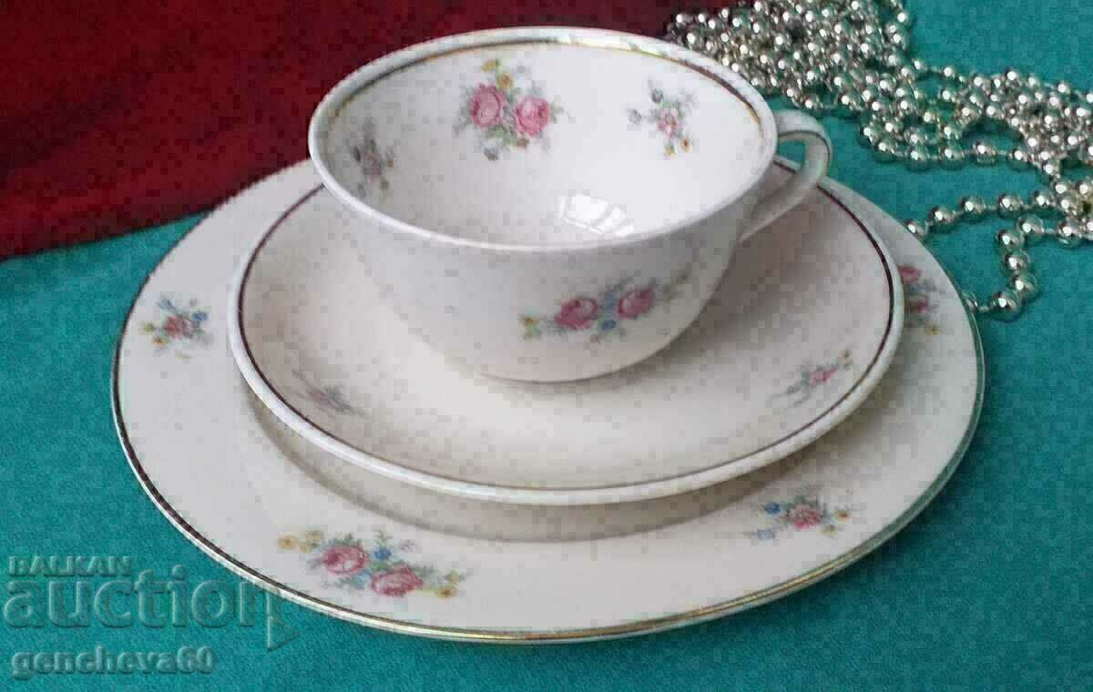 Triple teacup set with floral motifs/marking