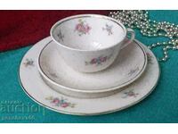 Triple teacup set with floral motifs/marking