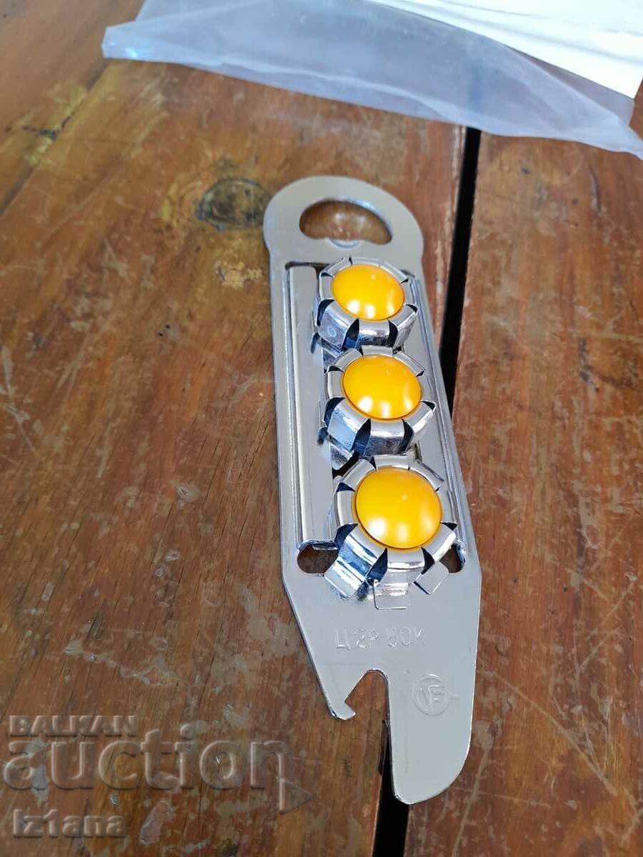 Auction  An old bottle opener