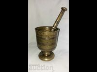 Old heavy bronze mortar and pestle