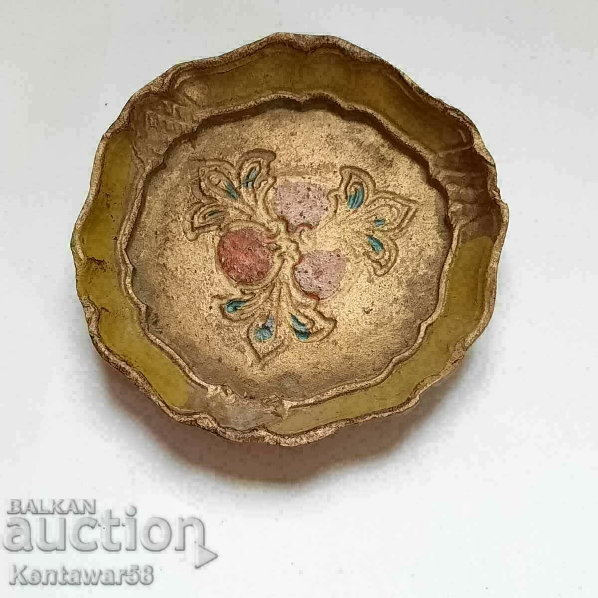 Painted wooden saucer.