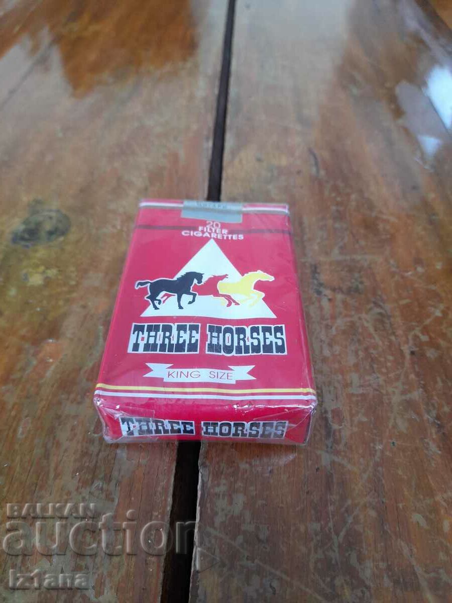An old pack of Three Horses cigarettes