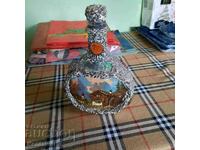 Unique lined glass bottle.