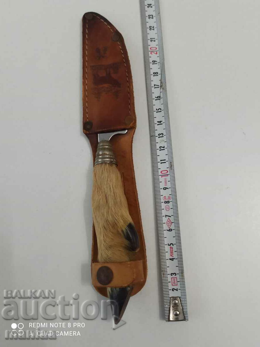 A hunting knife with a doe's foot handle