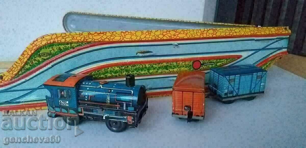 Delivery of Metal mechanical train with rails/1970