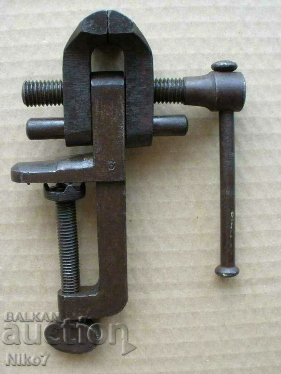 Old, marked, small vise. Old, marked, small vise.
