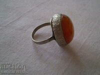 Old silver ring with natural Amber