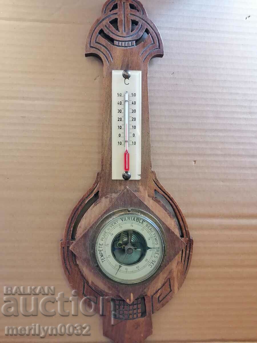 Old barometer with thermometer at the beginning of the 20th century