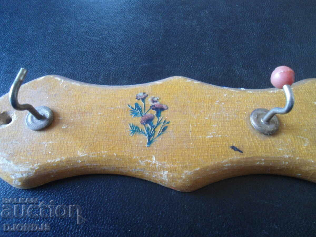 Auction An old wooden hanger Auction An old wooden hanger