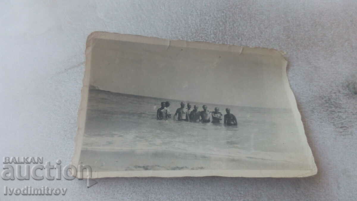Photo Eight men in the sea