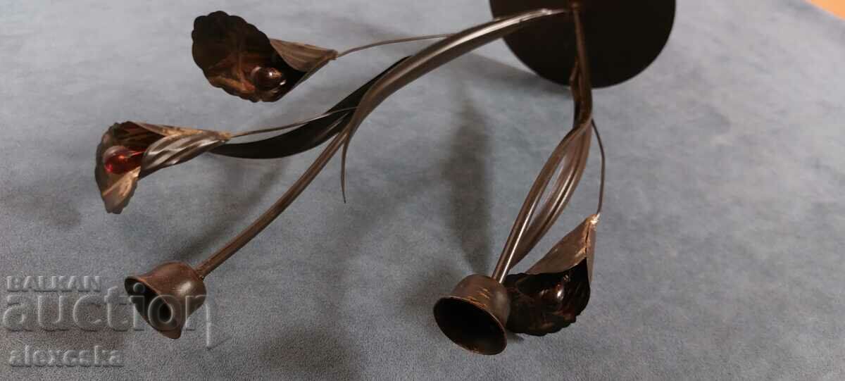 Delivery of An old metal candleholder Delivery of An old metal candleholder