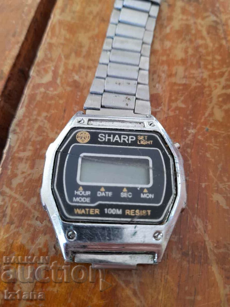 Old Sharp electronic watch with price 5.00 BGN | € 2.56 Old Sharp electronic watch with price 5.00 BGN | € 2.56