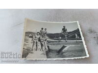 Photo Man, woman and four children at a swimming pool
