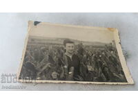 Photo Woman among fields planted with tobacco
