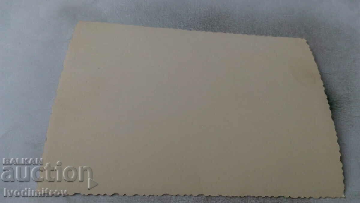 Photo Man and women around a table with price 1.45 BGN | € 0.74 Photo Man and women around a table with price 1.45 BGN | € 0.74