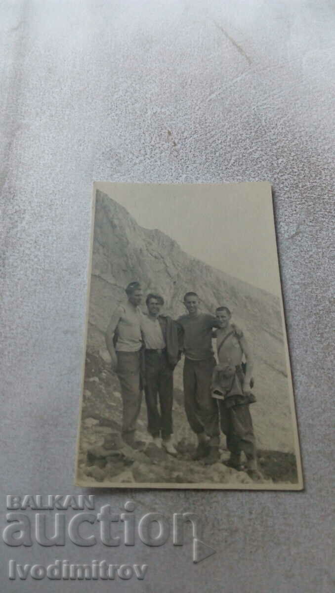 Photo Four soldiers in the mountains