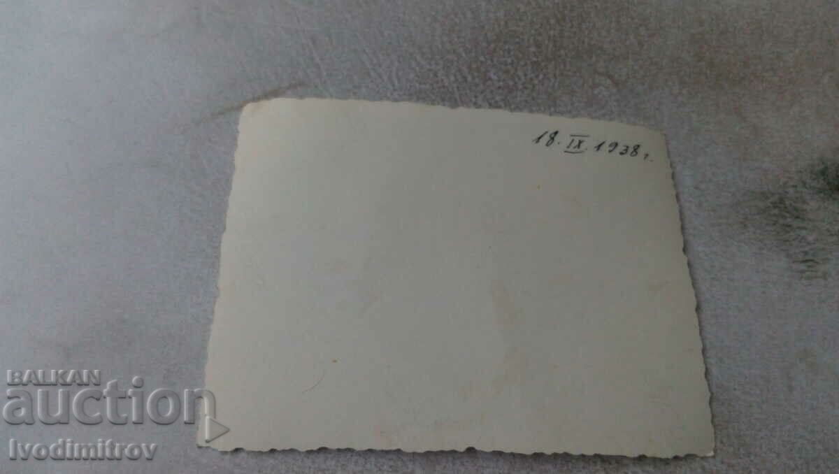 Photo Men, women and two girls in front of a house, 1938 with price 0.95 BGN | € 0.49 Photo Men, women and two girls in front of a house, 1938 with price 0.95 BGN | € 0.49