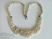 Very old long solid bone necklace