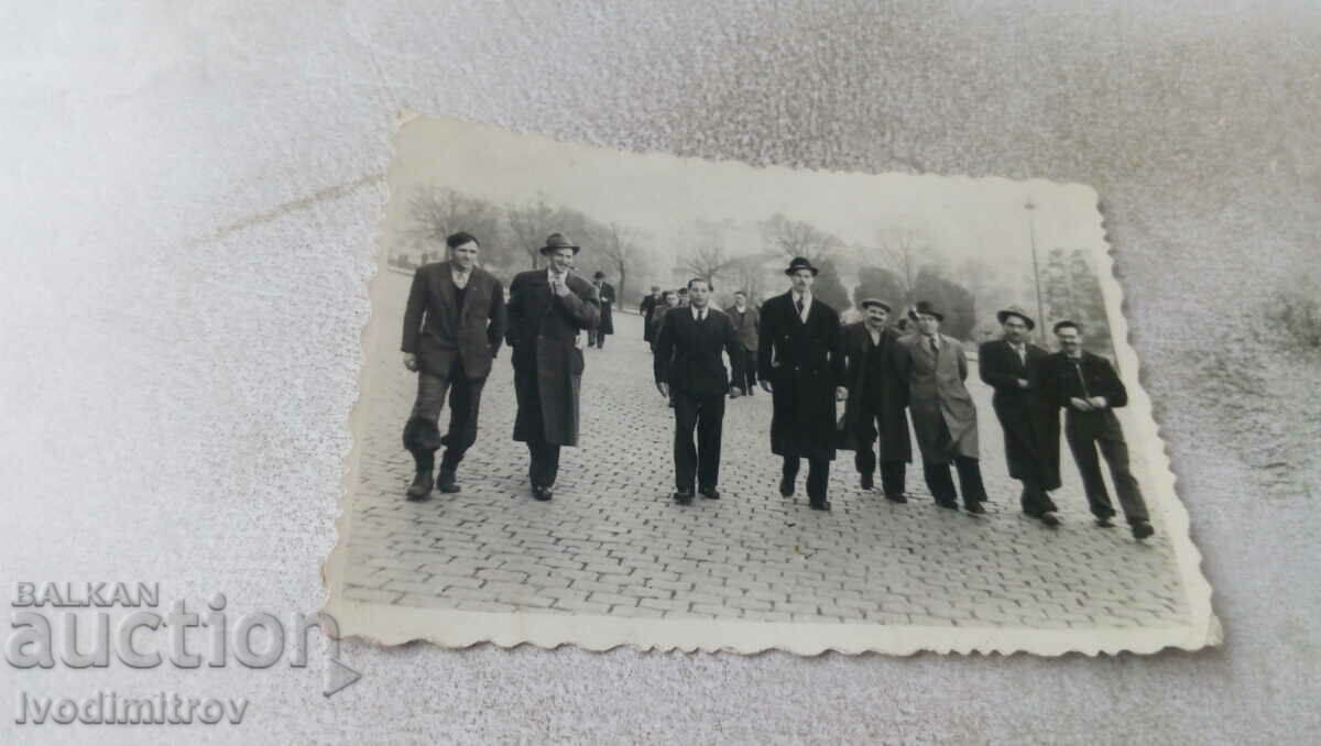 Photo A group of men at a placard