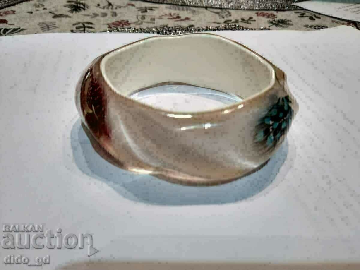 A unique beautiful bracelet with feathers, made of hardened sea foam A unique beautiful bracelet with feathers, made of hardened sea foam