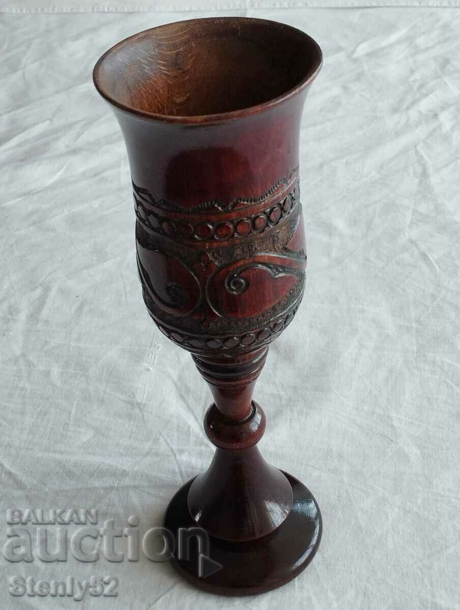 Indian wood vase with carving.