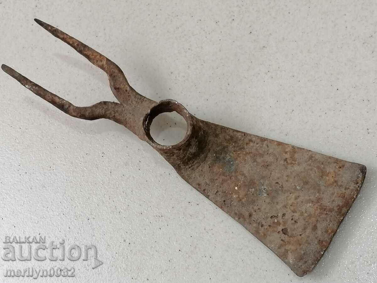 An old chapel two-tooth wrought iron tool