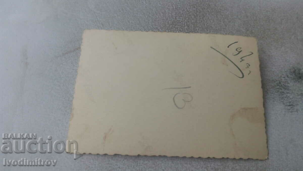 Photo Three young women in folk costumes by a fence in winter with price 1.65 BGN | € 0.84