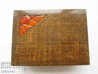 Old wooden Russian cigarette box with amber mosaic