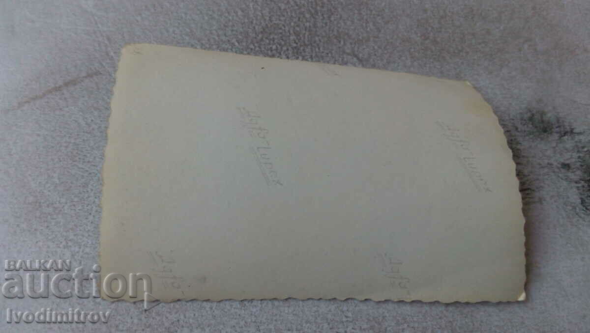 Photo A man and two women sitting in front of a truck cab with price 0.75 BGN | € 0.38 Photo A man and two women sitting in front of a truck cab with price 0.75 BGN | € 0.38