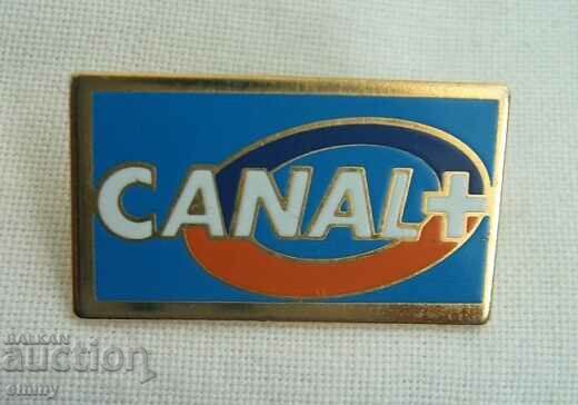 Promotional badge - CANAL + , French TV channel